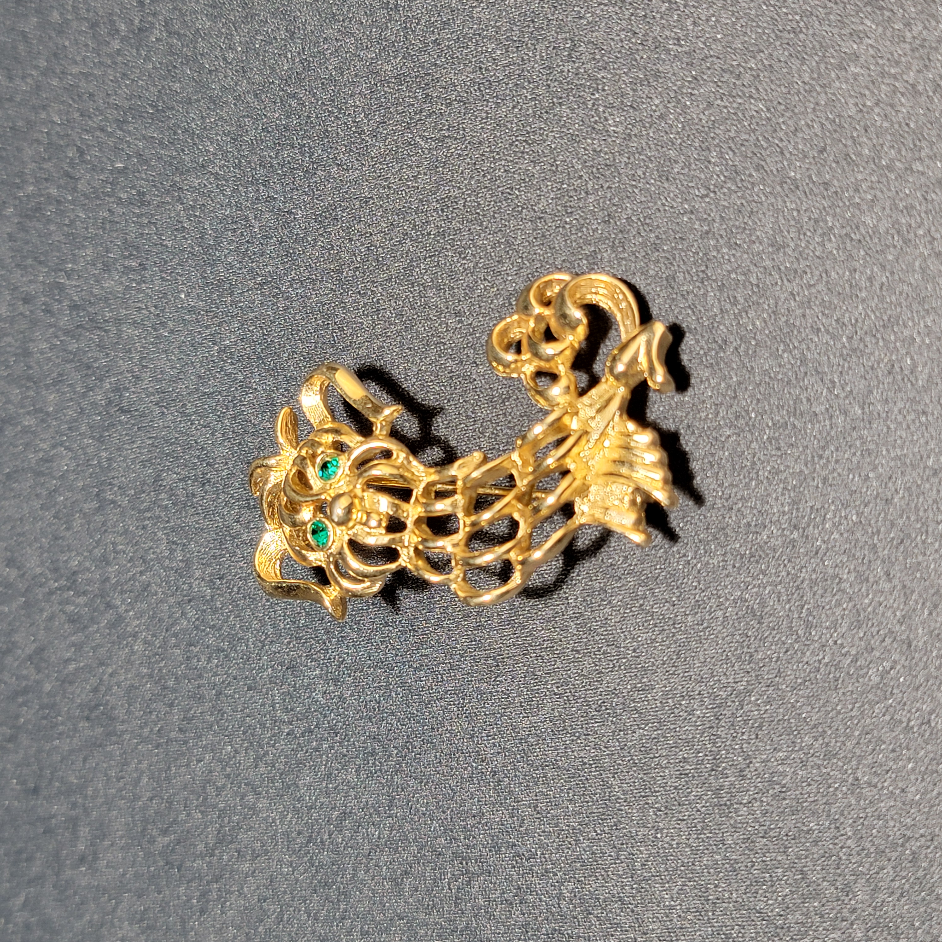 Front view of Avon 1972 Maltese Pekinese brooch